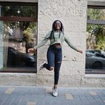 city-portrait-positive-young-dark-skinned-female-wearing-green-hoody-eyeglasses_optimized_150 (1)
